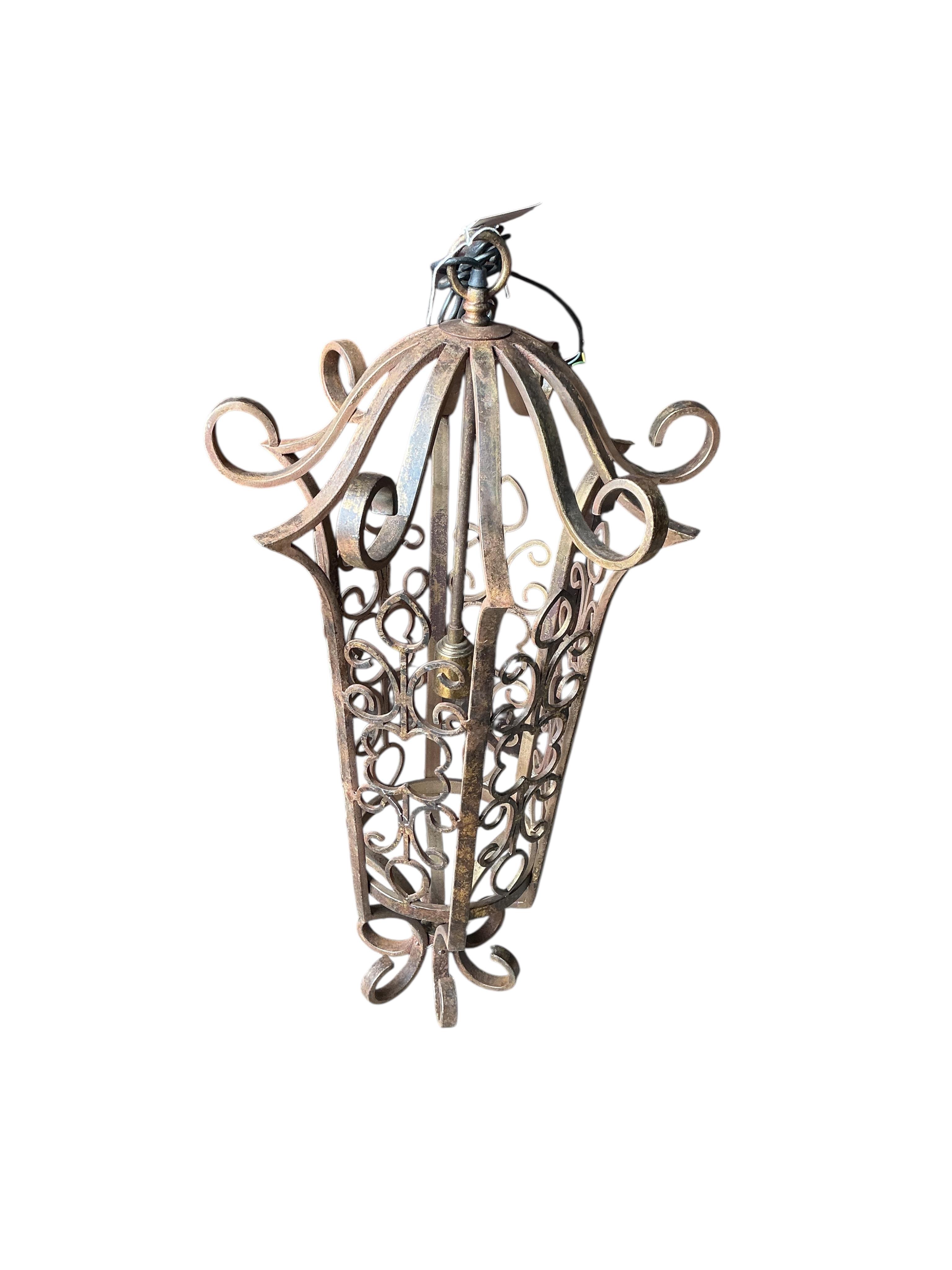 A wrought iron hexagonal hall lantern, height 90cm
